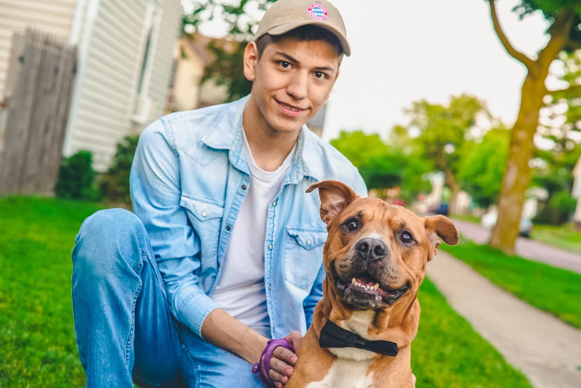 A young volunteer posing with a dog